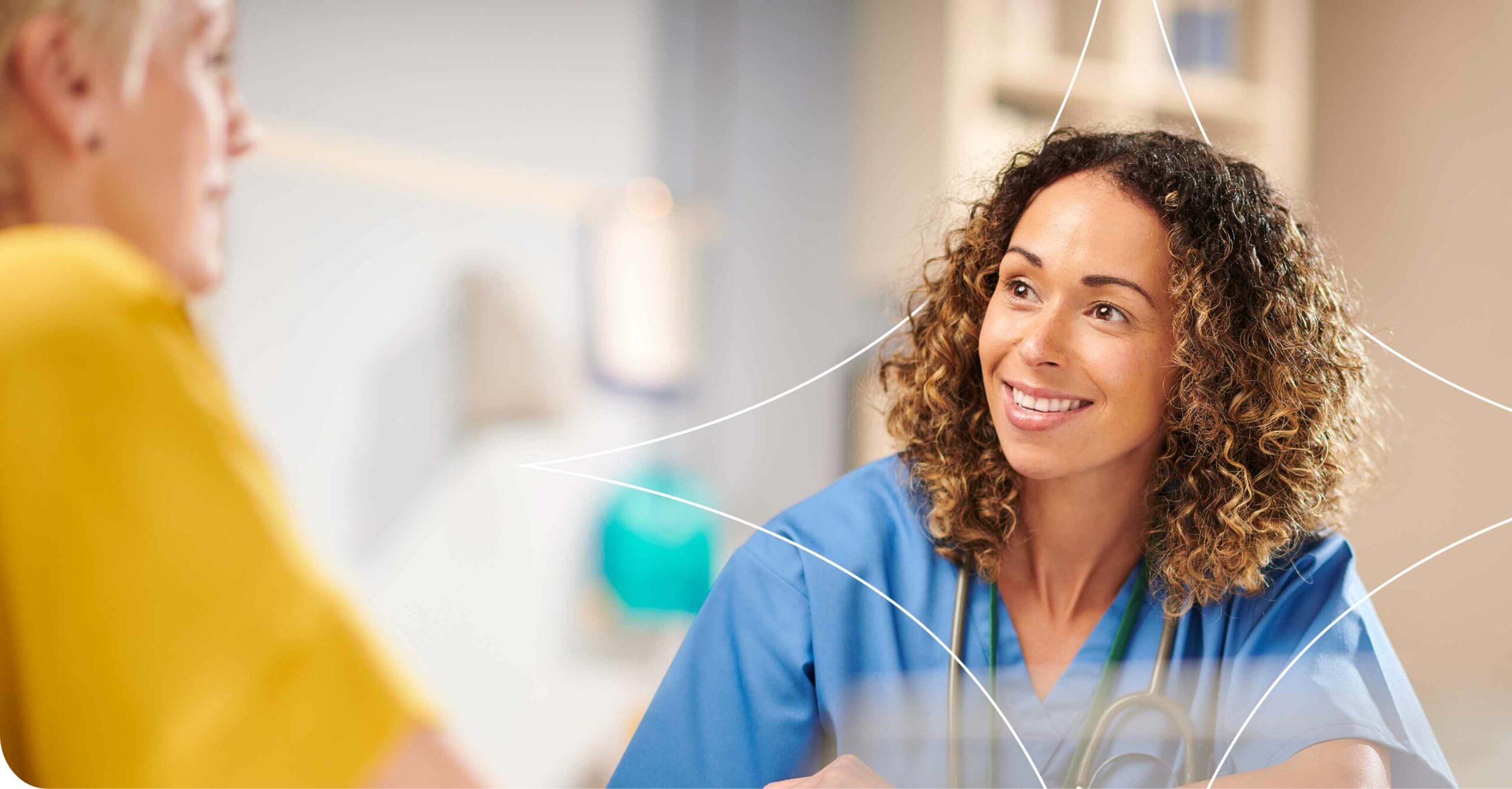 Doctor and patient smiling during a happy medical consultation