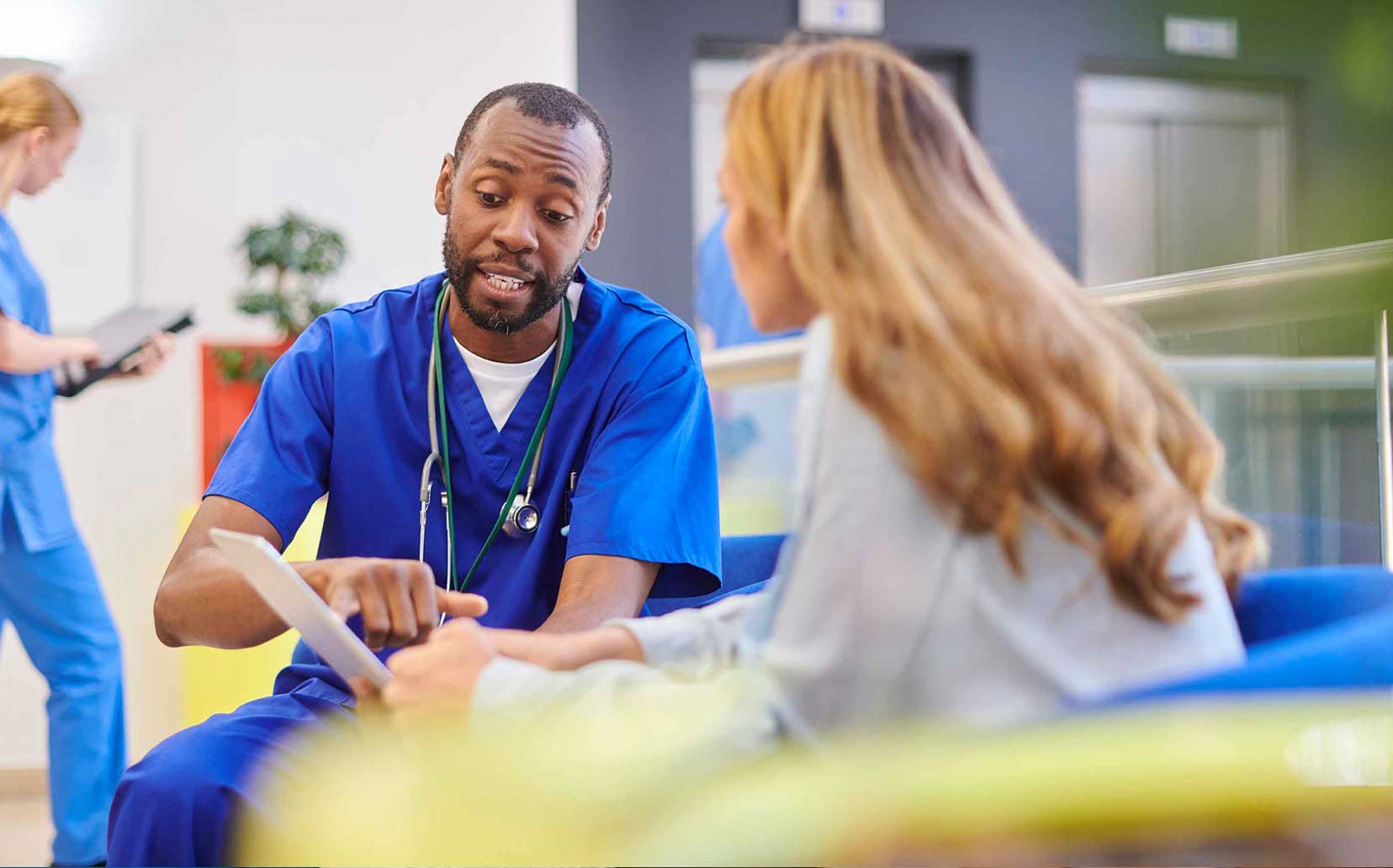Male doctor explaining something to a patient